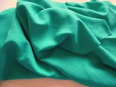 Light weight polyester fabric-medium green with check patttern 1 yd 28″ by 45″