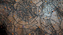 Spellbound Sparkle Spiderweb Lace — 56” x 104” — Black Webs + Orange Sequins