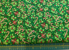 FABRI-QUILT-SEASON’S GREETINGS #930 CANDY CANES & HOLLY ON GREEN COTTON- 1 1/8YD