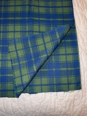 Blue/green plaid in medium weight looser weave synthetic fiber, 38″Lx54″W