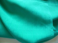 Light weight polyester fabric-medium green with check patttern 1 yd 28″ by 45″