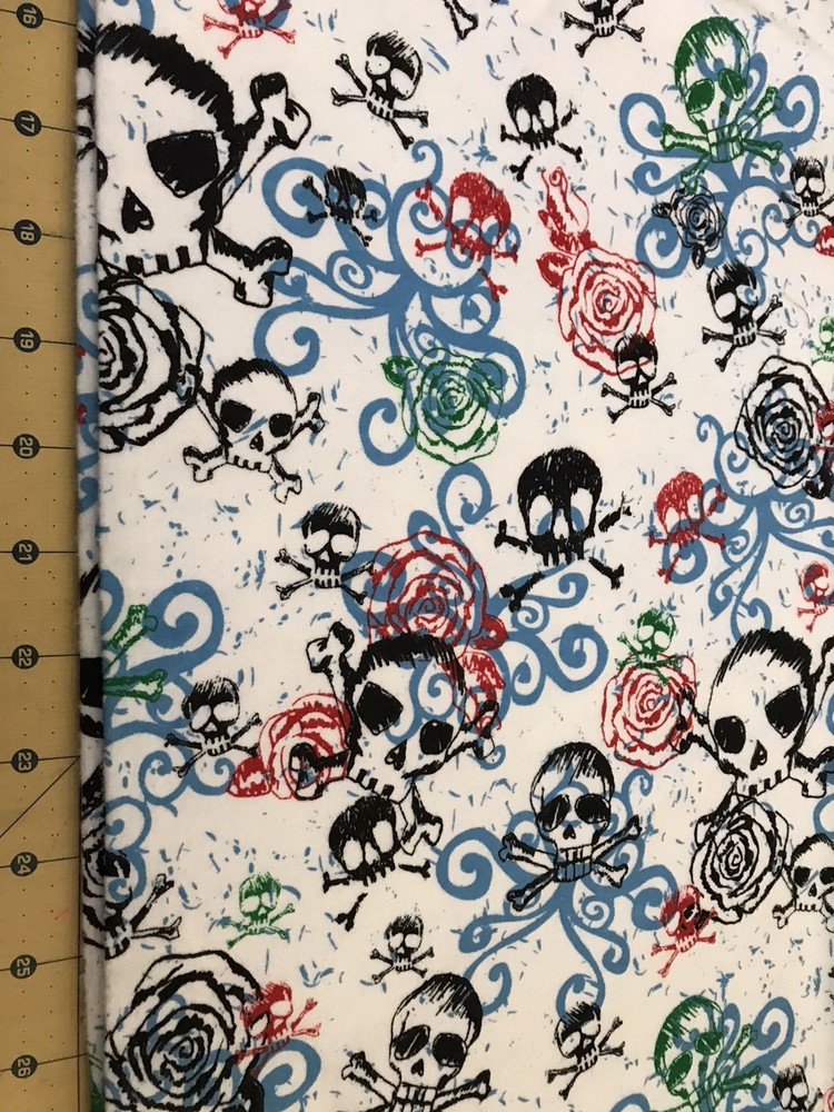 2010 Bones Skulls and Roses on White Flannel fabric sold by the yard #2637