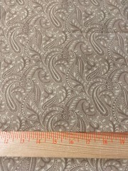 Paisley print cotton quilting weight fabric in shades of tan 51″ x 54″