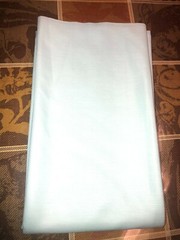 54″L x 62″W light aqua/mint green knit fabric remnant, medium weight & stretch