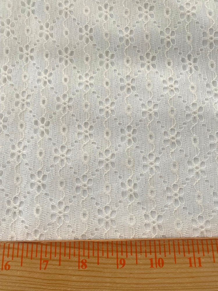 Off white polyester lace /vertical stripe floroal design 3 yds x 56″