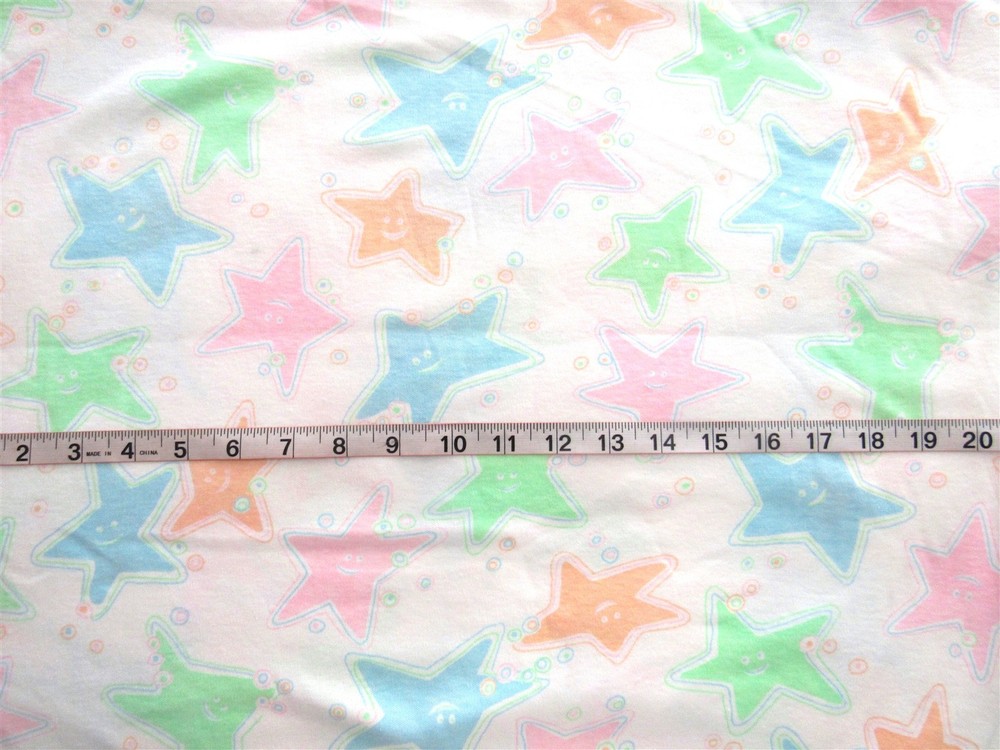 1 yd x 62″ Knit Fabric One-Way Stretch, White with Pink Blue Green Orange Stars