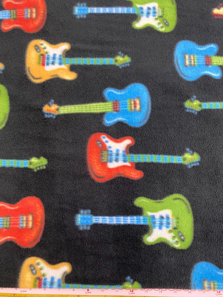 Richlin Fabrics ~ 100% Poly- Yukon Fleece ~ Guitars ~ 60″ wide ~ per half yard