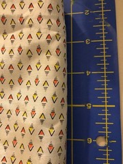 F-23 046 Silky synthetic fabric-1 1/2 yd x 44″-lg tan, red, yellow black design