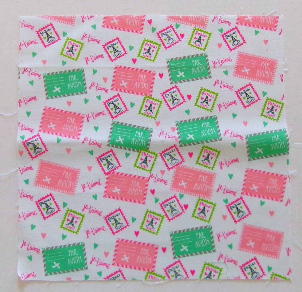 Cotton Fabric Pic B – Paris Stamps on White – 10 5/8″ L x 10 3/4″ W Quilt Sew