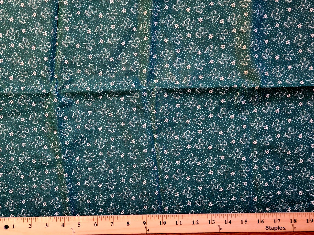 100% cotton Green fabric with white bows and flowers 44″ w x 1 yard