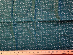 100% cotton Green fabric with white bows and flowers 44″ w x 1 yard