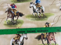 Wilmington prints Riders on the Range western, cowboys, roping tan BTY