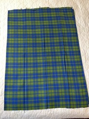 Blue/green plaid in medium weight looser weave synthetic fiber, 38″Lx54″W