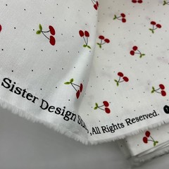 Red Cherries with Green Leaves on White with small Polka Dots Background