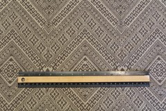 Geometric pattern woven upholstery decorator material in taupe and ecru
