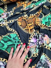 Snake print, Animal print, Jersey Knit Fabric. GREEN ORANGE STRETCH FABRIC Black