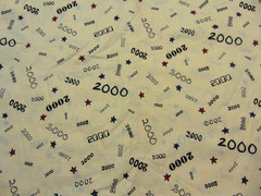 General Fabrics Year 2000 All Over Print Ecru-Red/Blue Stars 1yd x 46″