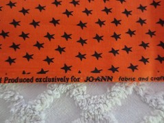 5143. Jo-Ann BLACK STARS on ORANGE Craft, Quilting COTTON FABRIC-42″ x 3 yds.