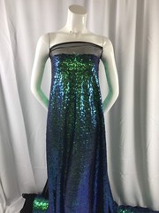GREEN IRIDESCENT MINI SEQUINS EMBROIDER ON A BLACK MESH-FASHION-SOLD BY YARD.
