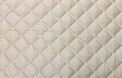 100% silk dupioni padded and quilted in diamond design by Scalamandre 8015