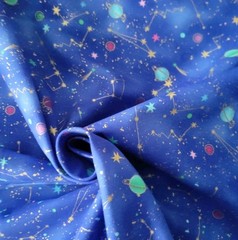 Small Planets, Stars, Constellations in Outer Space on Mottled Blue Ground