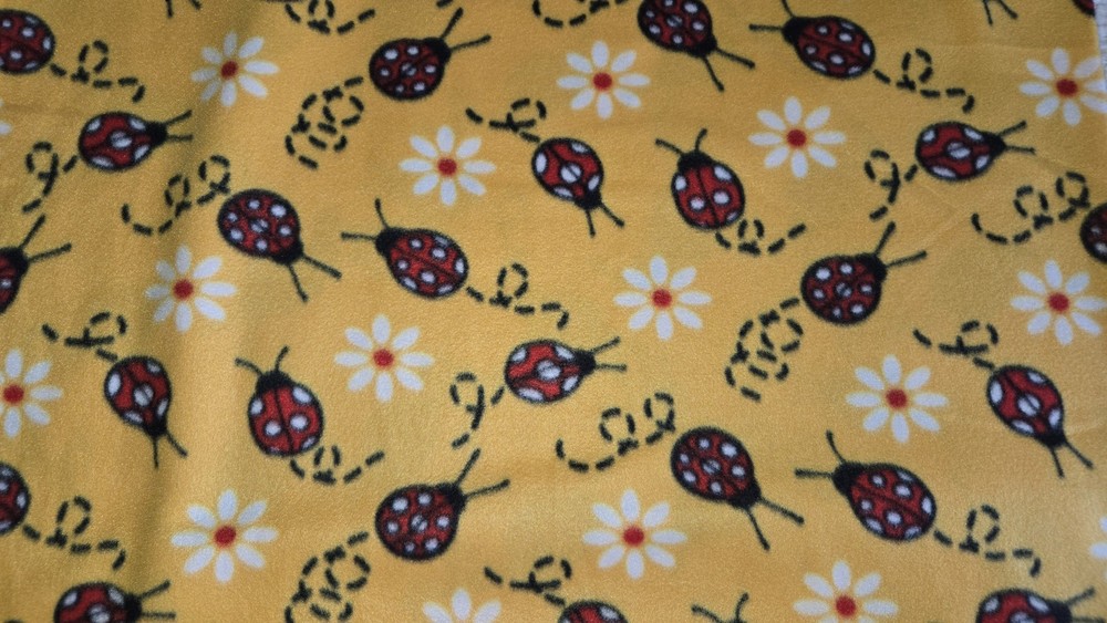 Blizzard Fleece Lady Bugs on Yellow By The Yard