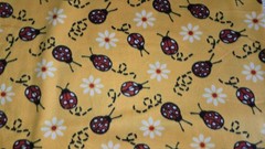 Blizzard Fleece Lady Bugs on Yellow By The Yard