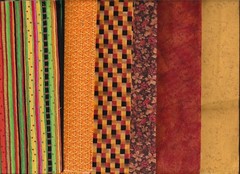 SIX QUARTERS OF VARIOUS BRANDED FABRIC.