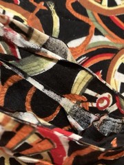 Cotton Fabric Wagon Wheels Avocado Yellow Red Orange on Black 2-7/8Y x 41″ W