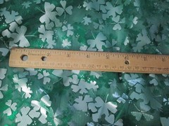 Green and Silver Sharmrock Print on Green Mesh Fabric 60 W x 2 yd AS IS Damaged