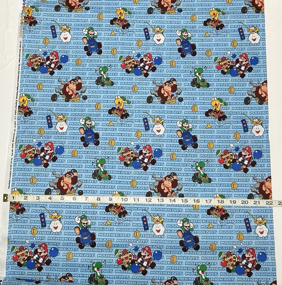 NEW cotton fabric half yard – Mario Kart Action – Characters on Blue Background