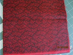 Black with red twig pattern from Marcus Brothers Fabrics