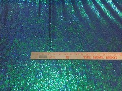 GREEN IRIDESCENT MINI SEQUINS EMBROIDER ON A BLACK MESH-FASHION-SOLD BY YARD.