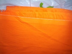 43 inches by 66 inches orange material fabric unknown from Jo Ann Fabric