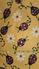 Blizzard Fleece Lady Bugs on Yellow By The Yard
