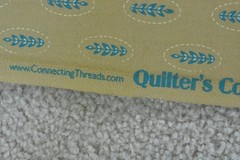 By 1/2 Yd, Blue Leaves on Tan Super-Combed-Cotton, Connecting Threads, V952