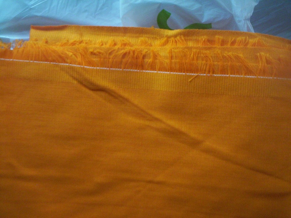 43 inches by 66 inches orange material fabric unknown from Jo Ann Fabric