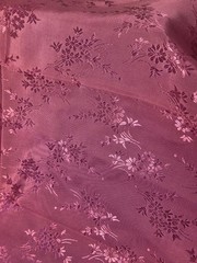 Polyester Taffeta fabric in dusty rose with floral jacquard design 47″ x 18.5″