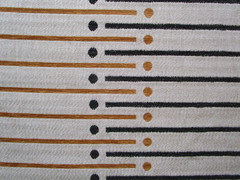 Schumacher’s Serapo Carbon Ochre Black Gold Ivory lines circles modern fabric 1y