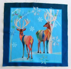 Deer Horns Snowflakes on Light Blue Pic B- 10 1/2″ L x 10 1/4″ W Light Blue Edge
