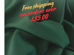 Hunter Green Tropical 100% Polyester non-stretch, machine washable.