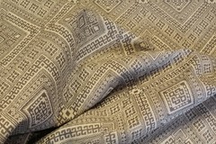 Geometric pattern woven upholstery decorator material in taupe and ecru
