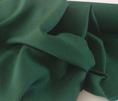 Hunter Green Tropical 100% Polyester non-stretch, machine washable.