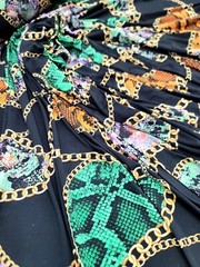 Snake print, Animal print, Jersey Knit Fabric. GREEN ORANGE STRETCH FABRIC Black