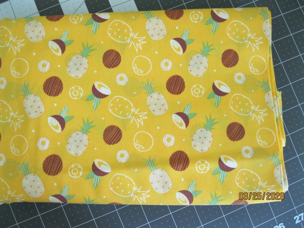 Pineapple and coconuts on yellow background from Camelot Fabrics