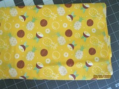 Pineapple and coconuts on yellow background from Camelot Fabrics