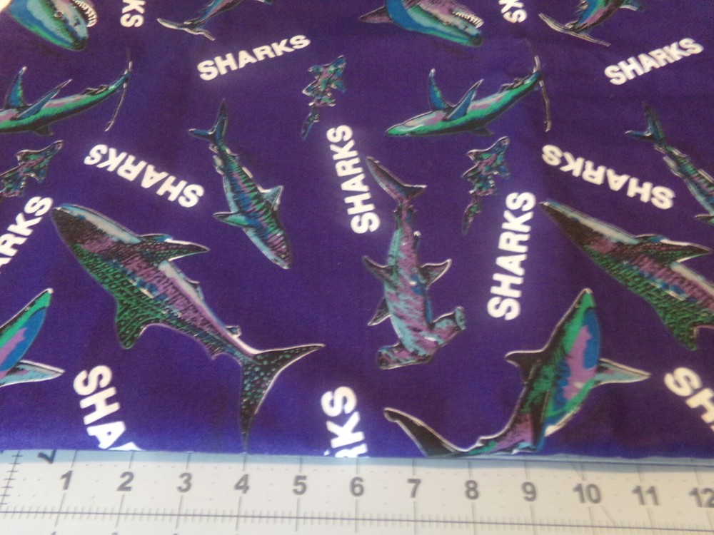 3/4 YD X 60″ COLORFUL SHARK’S ON NAVY BACKGROUND, by MARCUS BROS. # 4726