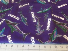 3/4 YD X 60″ COLORFUL SHARK’S ON NAVY BACKGROUND, by MARCUS BROS. # 4726