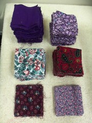 l.12 LBS VINTAGE LOT VARIOUS FABRICS CUT INTO 3.5″ SQUARES – MOST PURPLE COLORS
