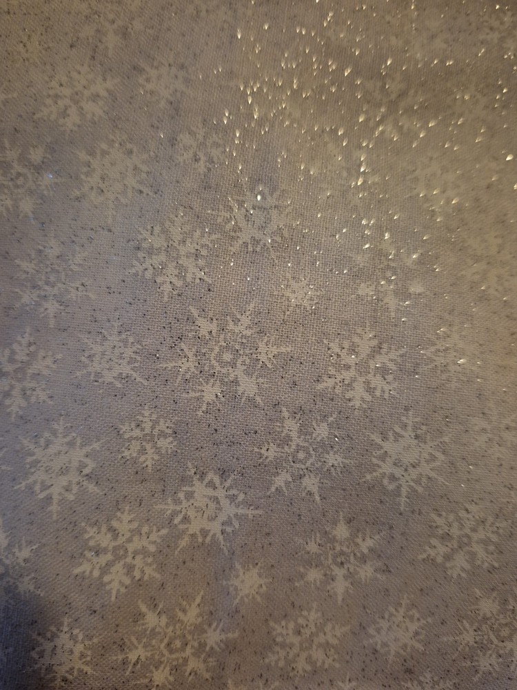 White Snowflakes On white fabric with silver glitter. One piece 42″ X 36″
